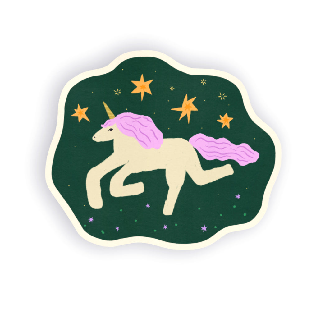 A die-cut sticker featuring a whimsical illustration of a cream-colored unicorn with a pink mane and tail, set against a dark green background with yellow stars.